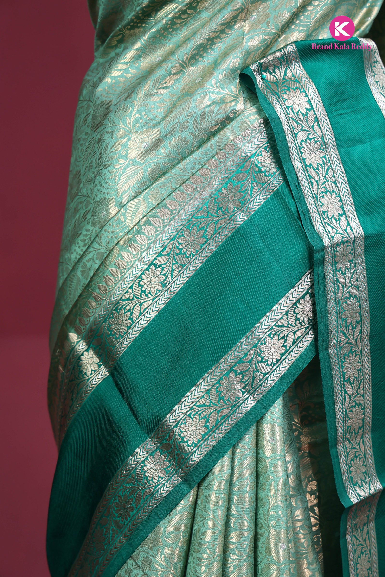 The deep bottle green saree