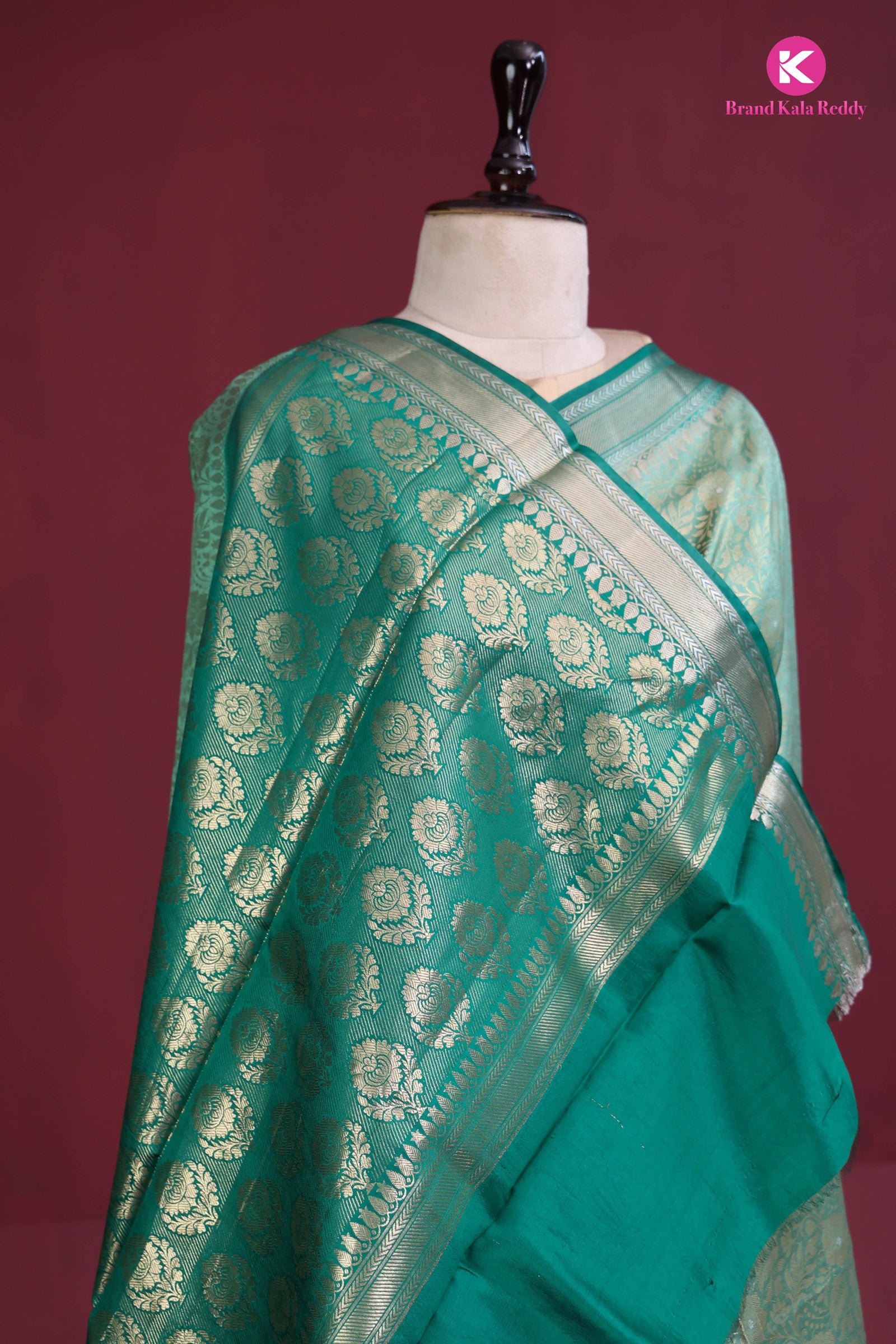 The deep bottle green saree