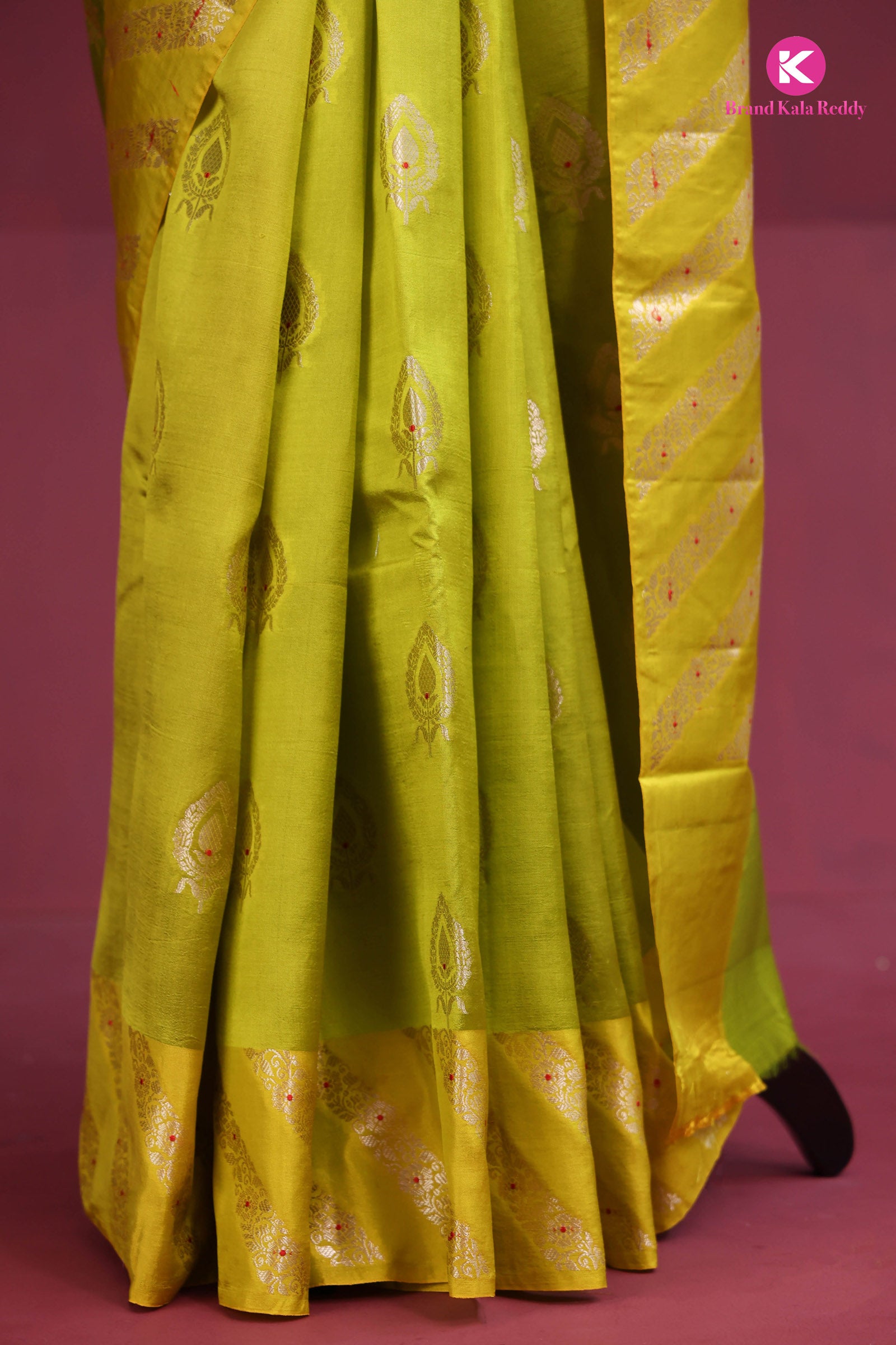 A lime green Banarasi saree