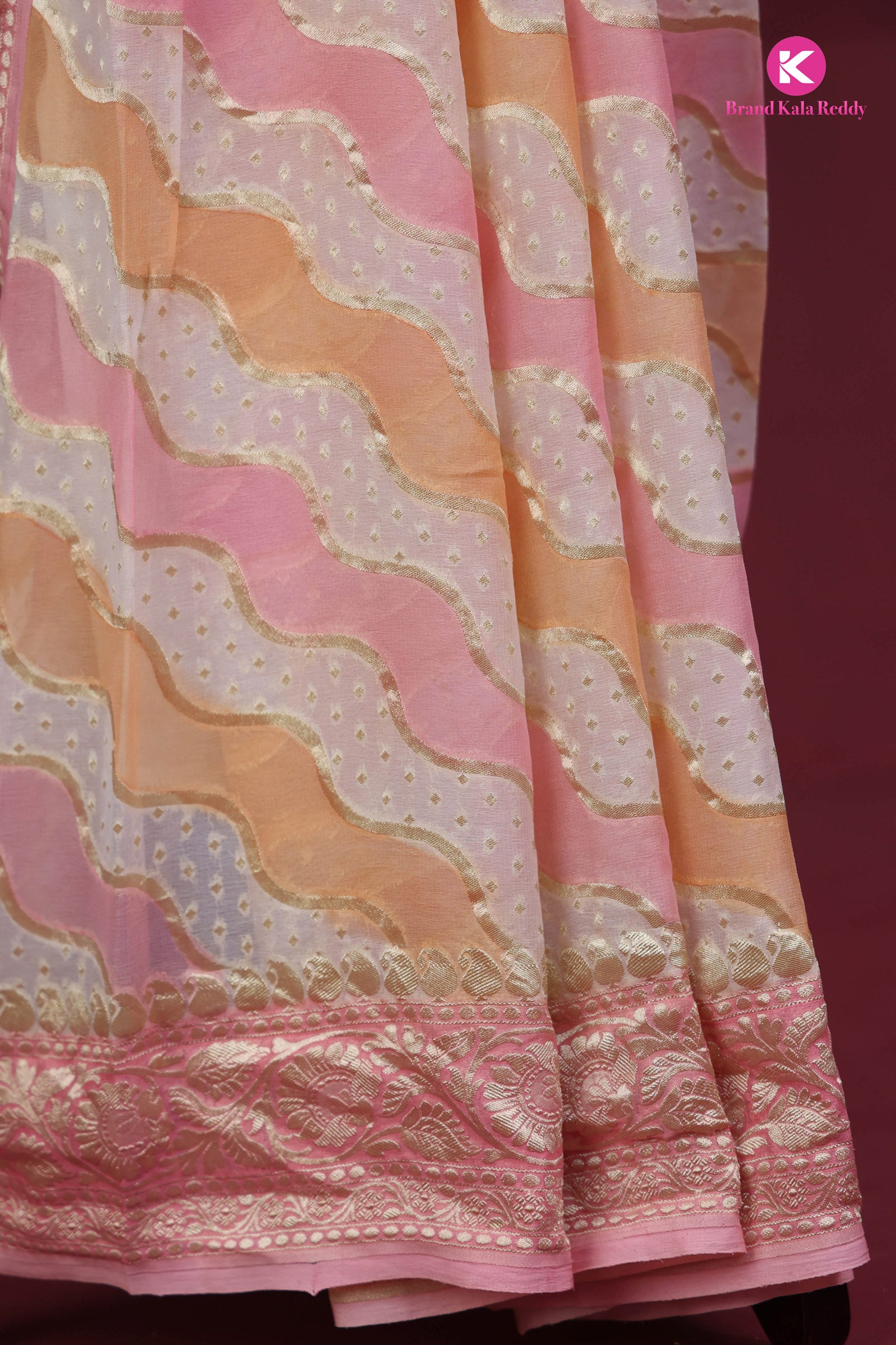A pastel pink colour Georgette Banarasi saree in Rankat style